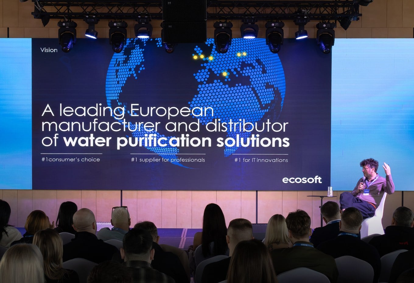 Ecosoft speaker presenting on stage at a live water-technology talk